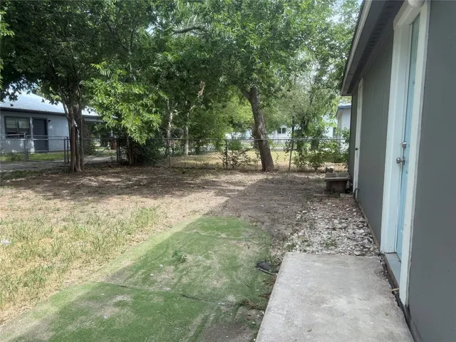 a view of a yard with trees