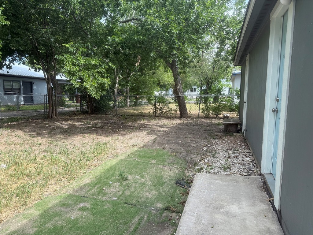 622 Trinity Street Lockhart, TX 78644 - Photo 15 of 16 a view of a yard with trees