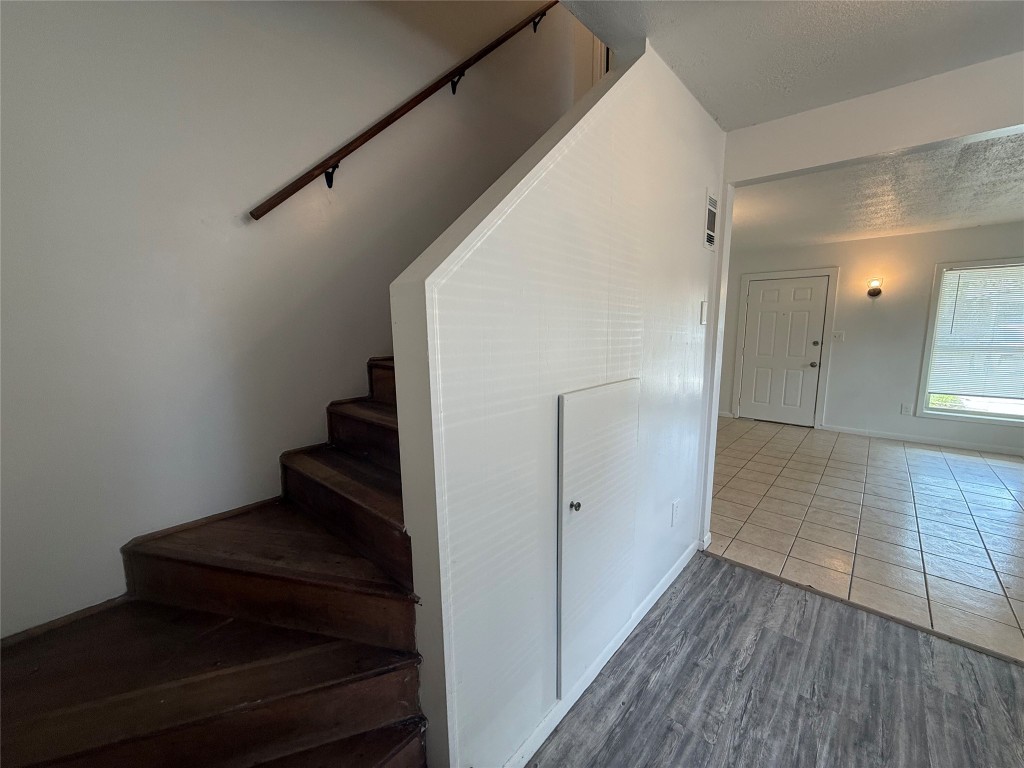 622 Trinity Street Lockhart, TX 78644 - Photo 9 of 16 a view of entryway and hall with wooden floor
