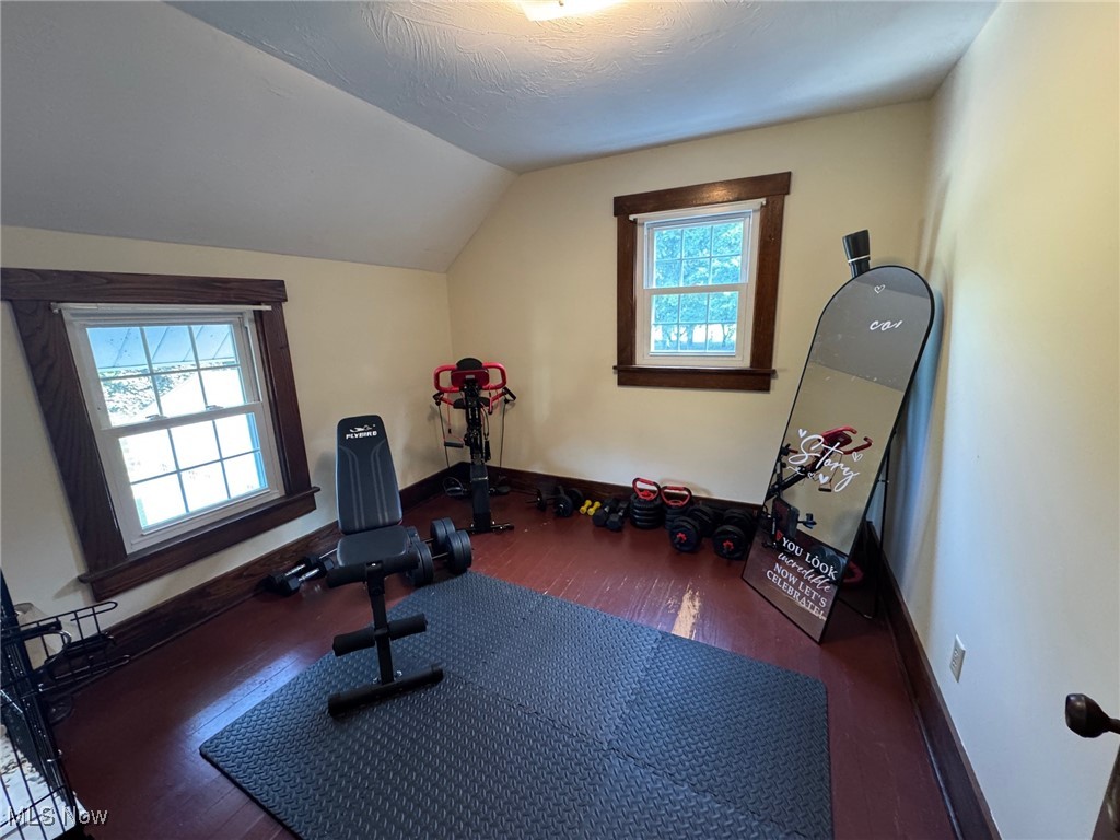 5322 Lockwood Road Madison, OH 44057 - Photo 27 of 30 Workout area with hardwood / wood-style floors and vaulted ceiling