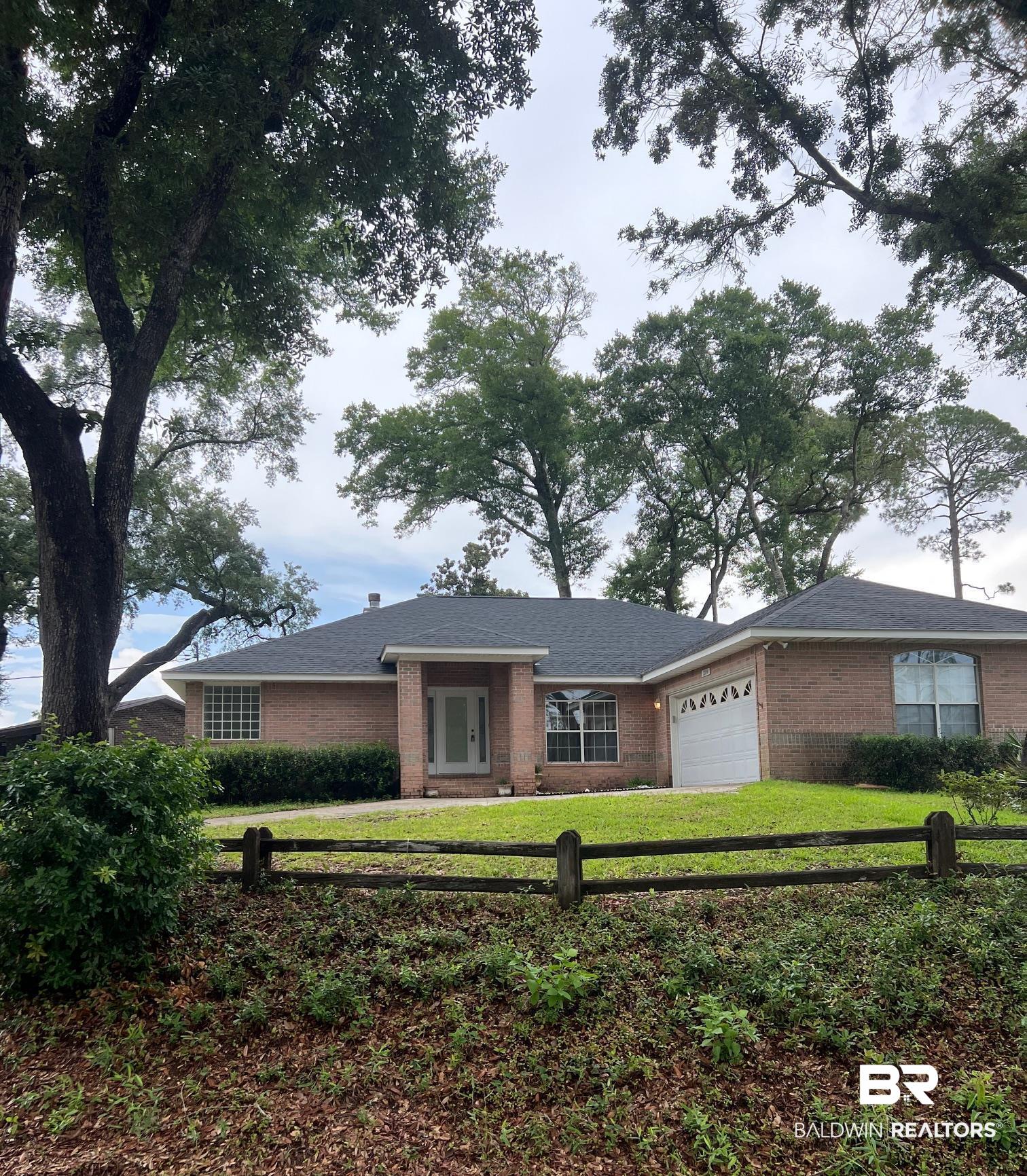2204 Club House Drive Lillian, AL 36549 - Photo 1 of 38 Ranch-style house with brick siding and a garage