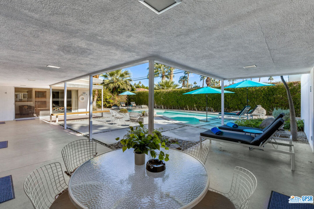1090 Sagebrush Road Palm Springs, CA 92264 - Photo 14 of 49 a building outdoor space with patio furniture and potted plants
