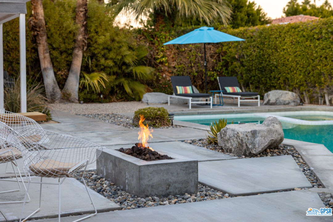 1090 Sagebrush Road Palm Springs, CA 92264 - Photo 15 of 49 a view of a fountain with an outdoor space