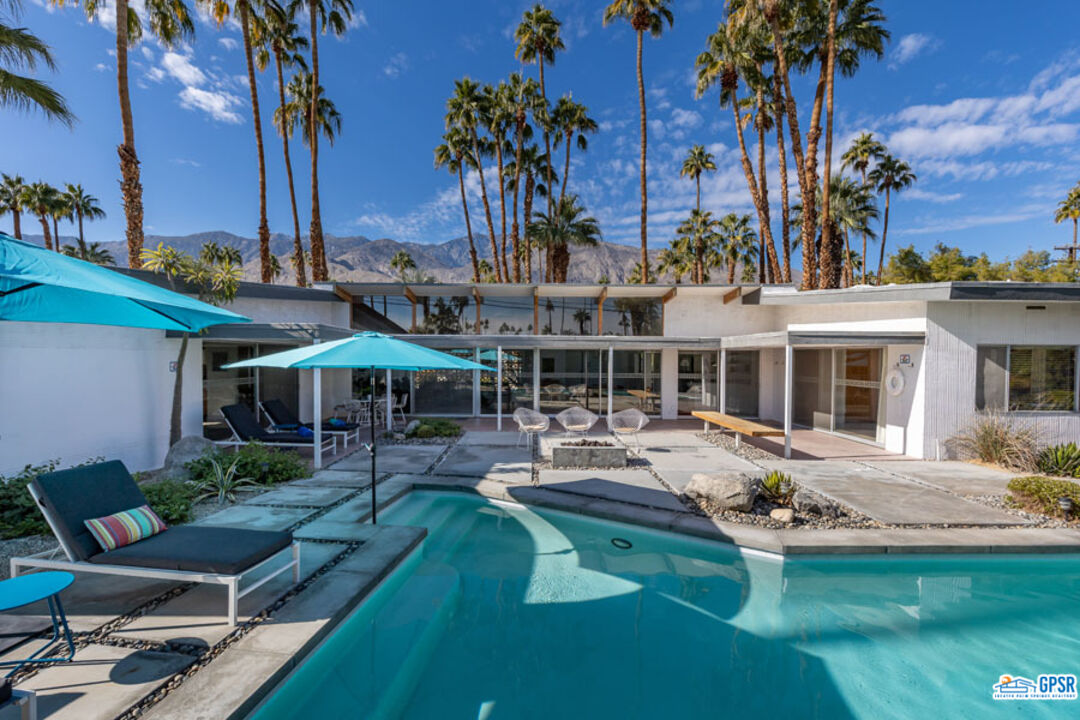 1090 Sagebrush Road Palm Springs, CA 92264 - Photo 2 of 49 a view of a house with swimming pool and sitting area