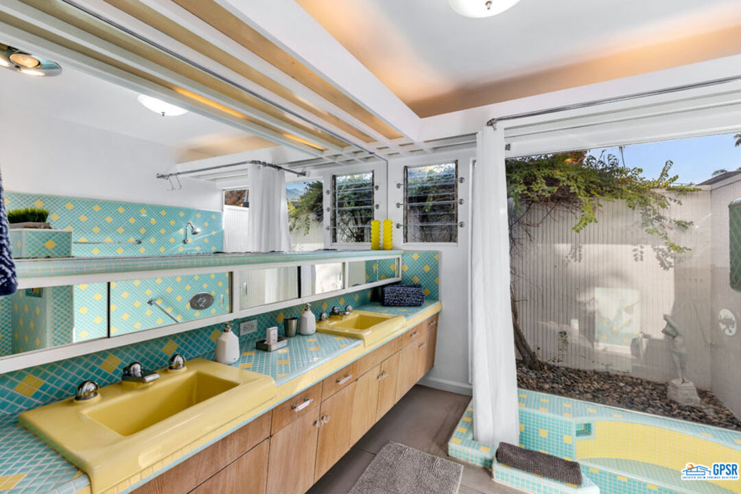 1090 Sagebrush Road Palm Springs, CA 92264 - Photo 29 of 49 a bathroom with a tub and a shower