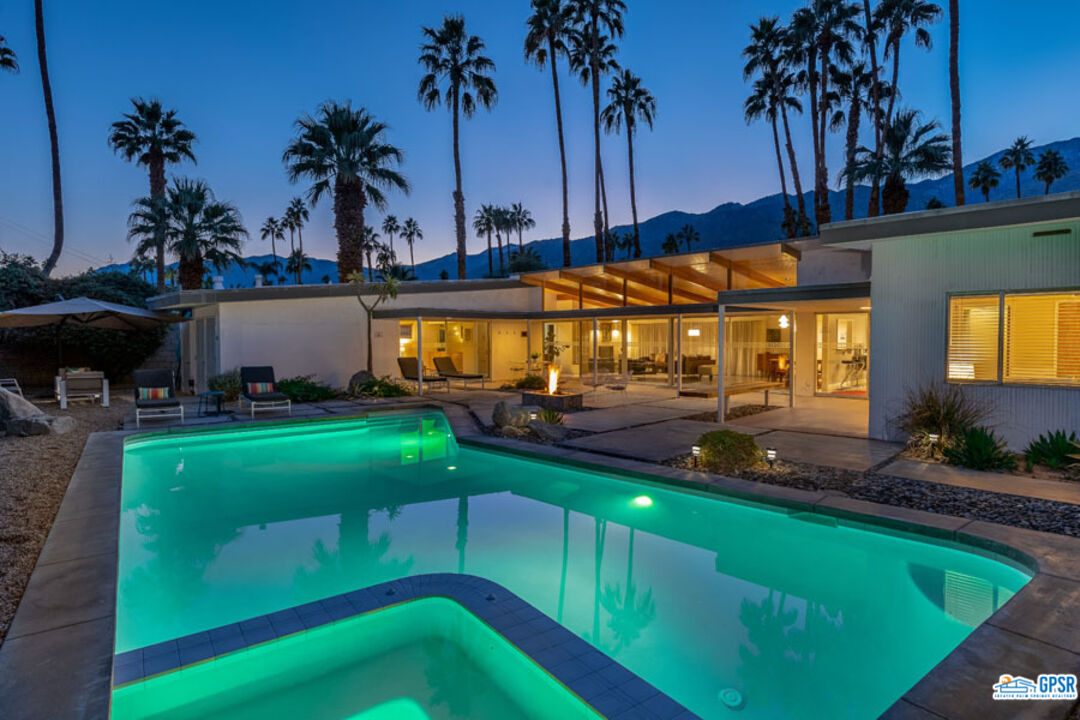1090 Sagebrush Road Palm Springs, CA 92264 - Photo 3 of 49 a view of a swimming pool with a table and chairs