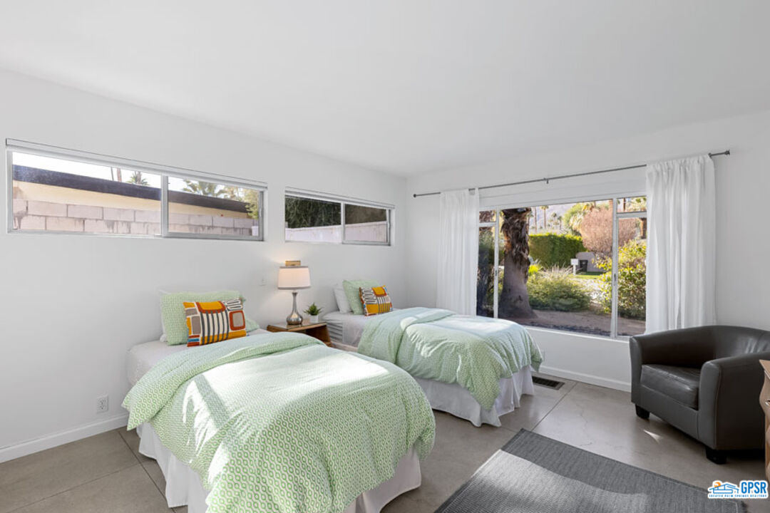 1090 Sagebrush Road Palm Springs, CA 92264 - Photo 32 of 49 a bedroom with two beds and a large window