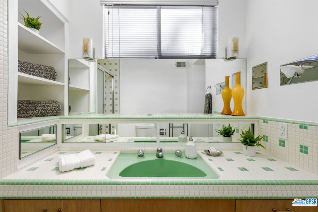 1090 Sagebrush Road Palm Springs, CA 92264 - Photo 35 of 49 a bathroom with a granite countertop sink and a mirror