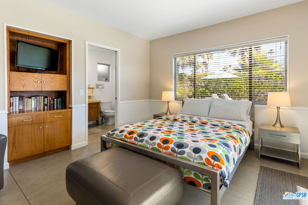 1090 Sagebrush Road Palm Springs, CA 92264 - Photo 38 of 49 a bedroom with a bed and a cabinets