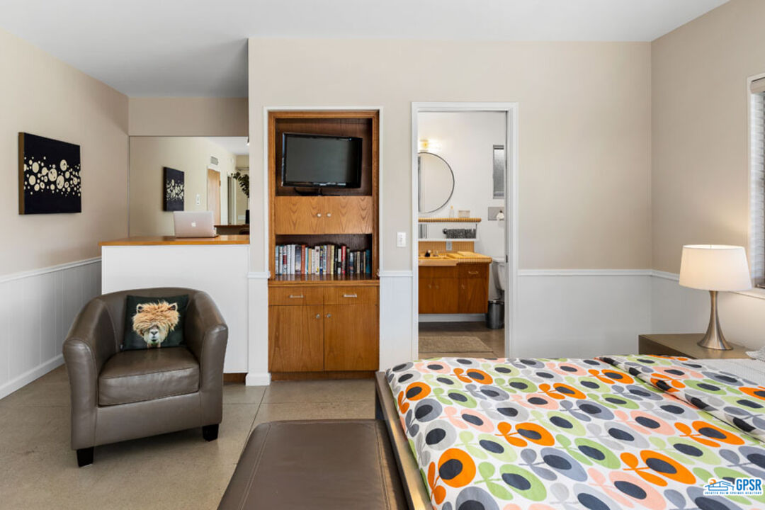 1090 Sagebrush Road Palm Springs, CA 92264 - Photo 39 of 49 a bedroom with a bed and a television