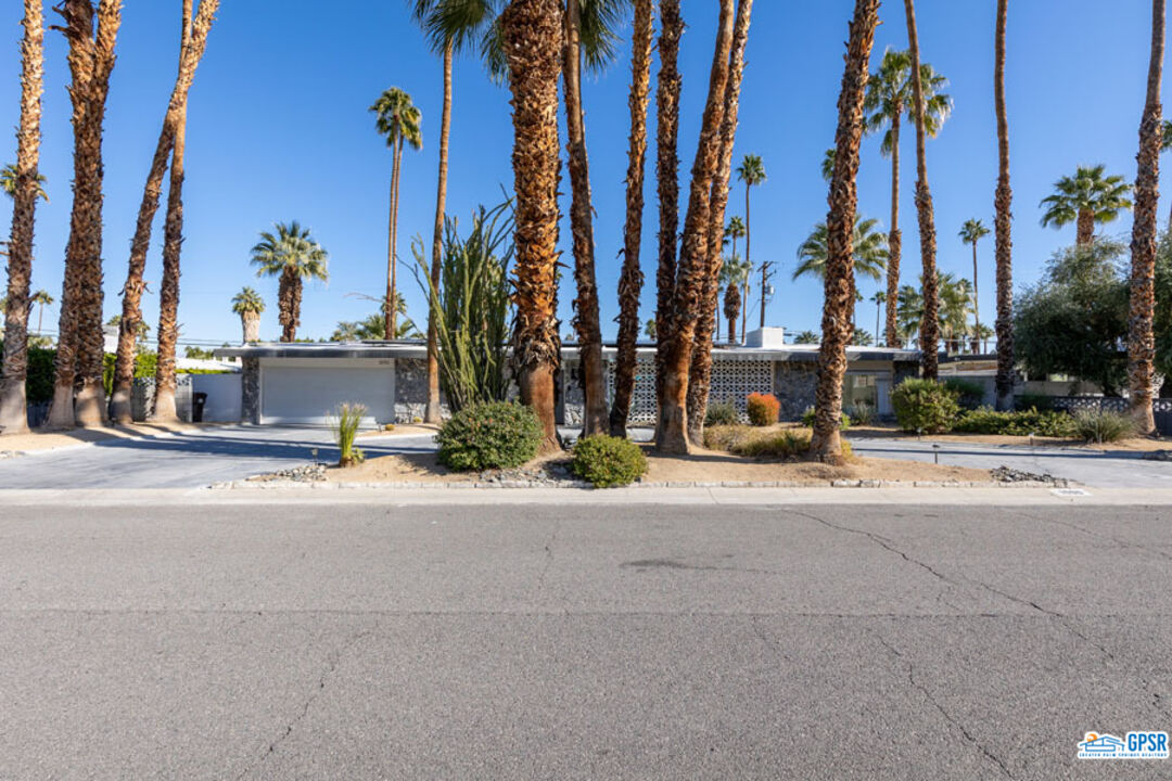 1090 Sagebrush Road Palm Springs, CA 92264 - Photo 4 of 49 a view of a street with a building in the background