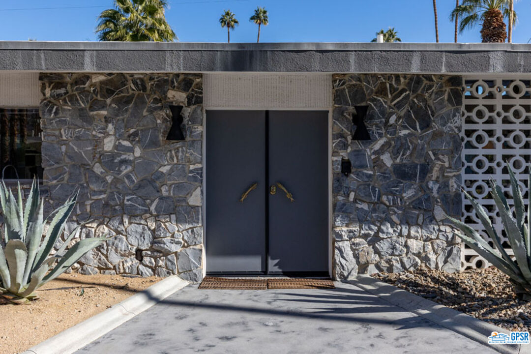 1090 Sagebrush Road Palm Springs, CA 92264 - Photo 6 of 49 a view of a door of the house