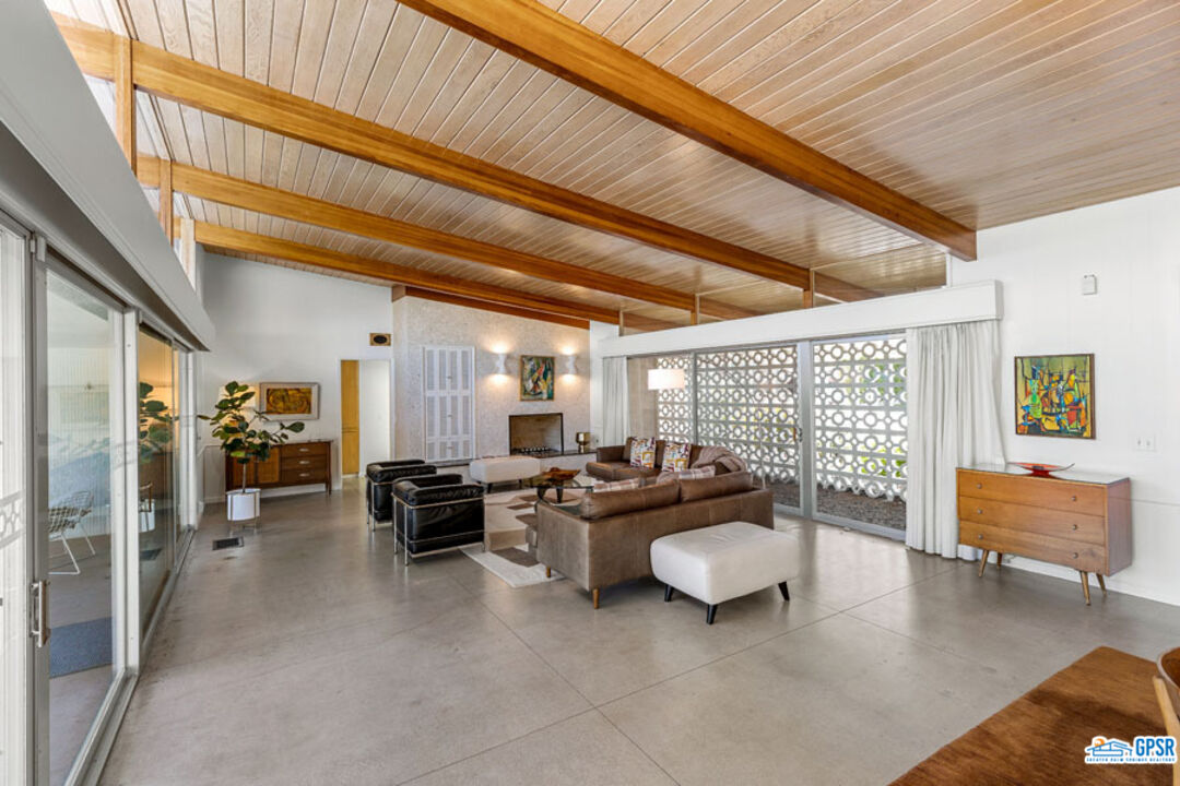 1090 Sagebrush Road Palm Springs, CA 92264 - Photo 10 of 49 a living room with furniture and a large window