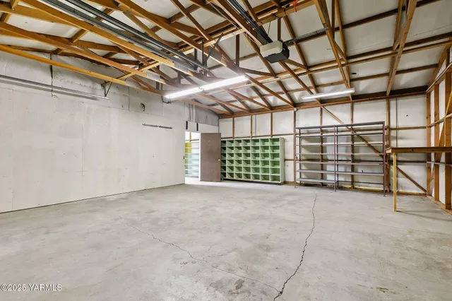 a view of a room with furniture and a garage