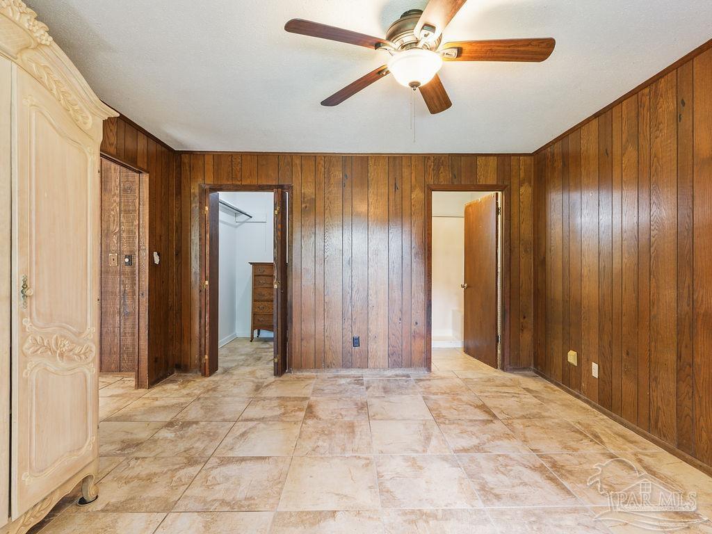 609 Dog Track Road Pensacola, FL 32506 - Photo 18 of 22 an empty room with closet and a chandelier fan