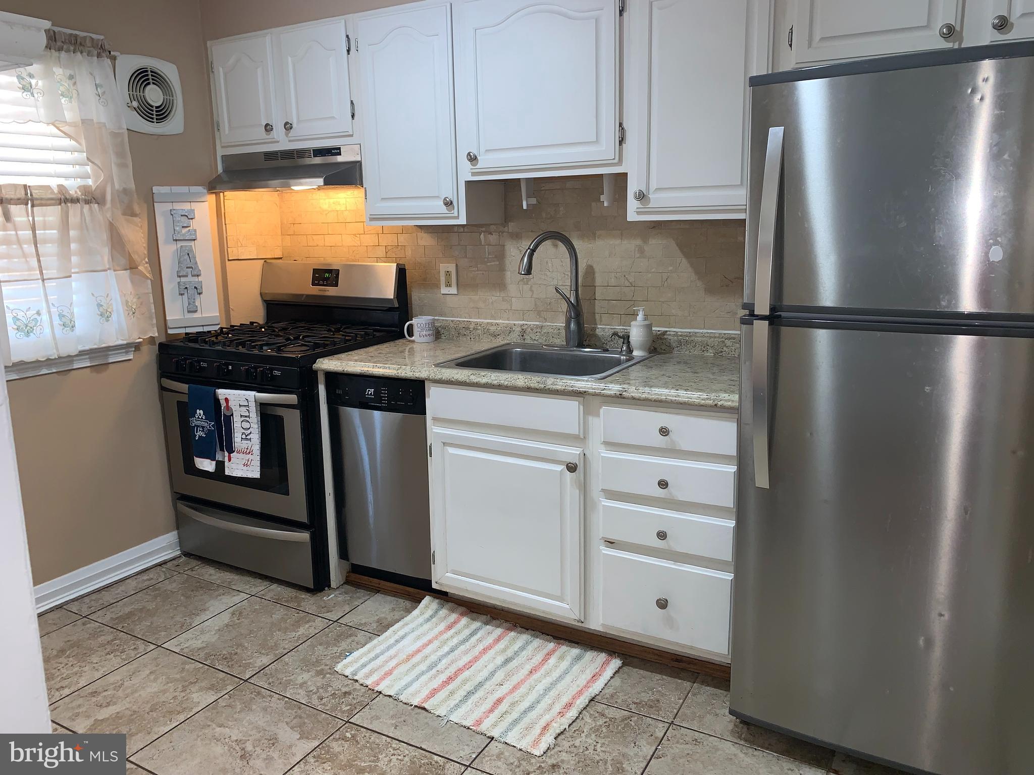 8646 Oak Road Baltimore, MD 21234 - Photo 10 of 37 KITCHEN WITH STAINLESS APPLIANCES
