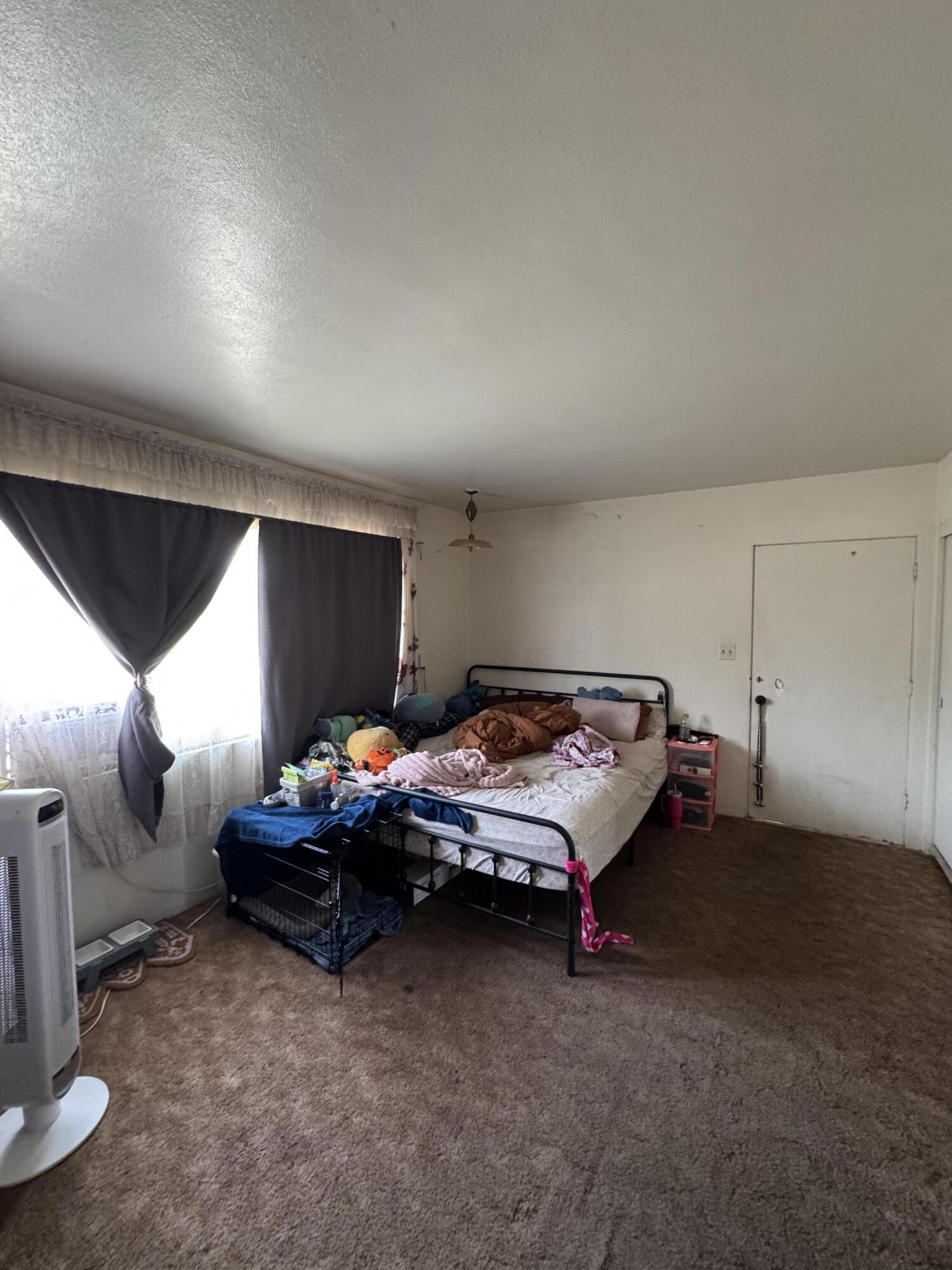 704 North Floral Street Visalia, CA 93291 - Photo 22 of 51 a bedroom with furniture and window