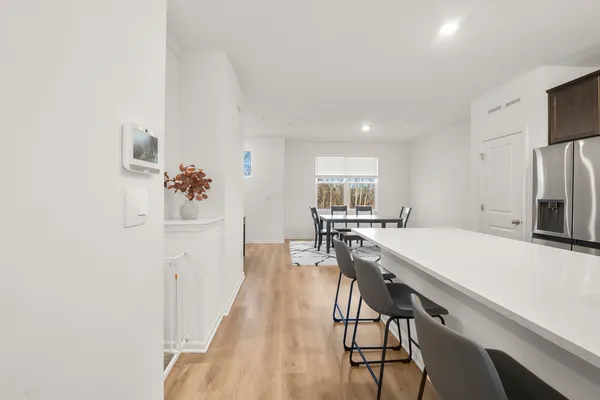 a view of a dining room with furniture and window