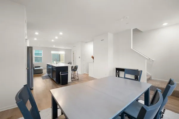 a kitchen with a table and chairs in it