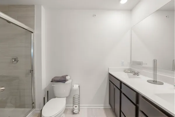 a bathroom with a glass shower door