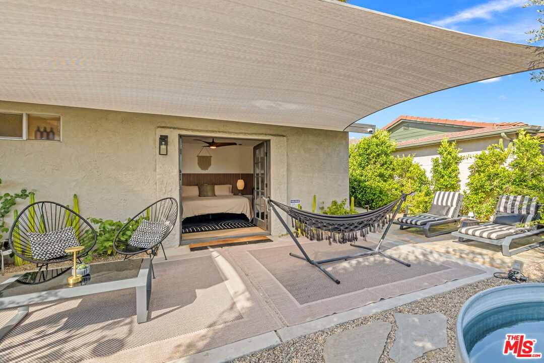 66869 San Ardo Road Desert Hot Springs, CA 92240 - Photo 22 of 39 a building outdoor space with patio furniture and potted plants