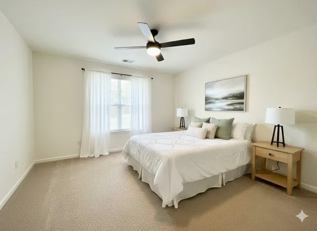 a bedroom with bed and window