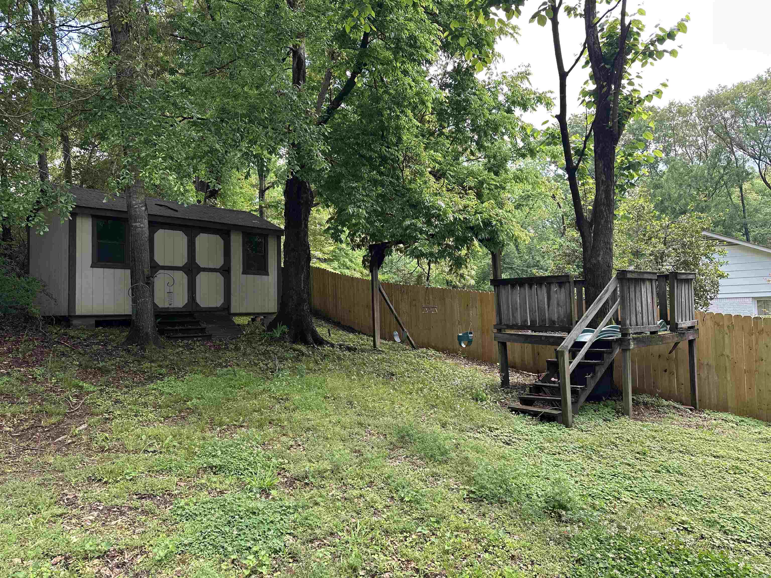 306 Old Jernigan Road Somerville, TN 38068 - Photo 19 of 22 a backyard of a house with table and chairs