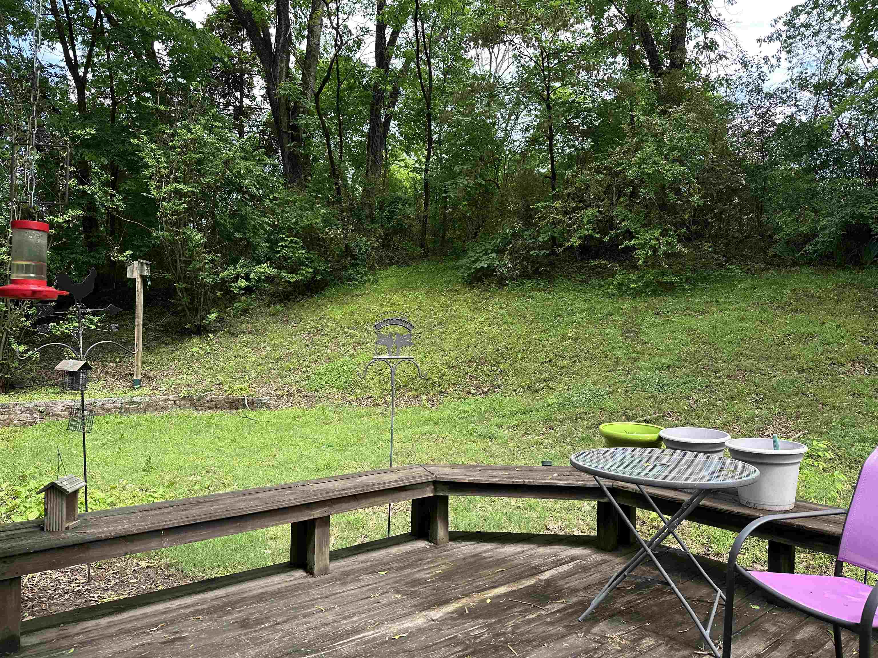 306 Old Jernigan Road Somerville, TN 38068 - Photo 20 of 22 a view of a wooden bench and chairs in the garden