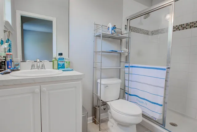 a bathroom with a toilet sink and shower