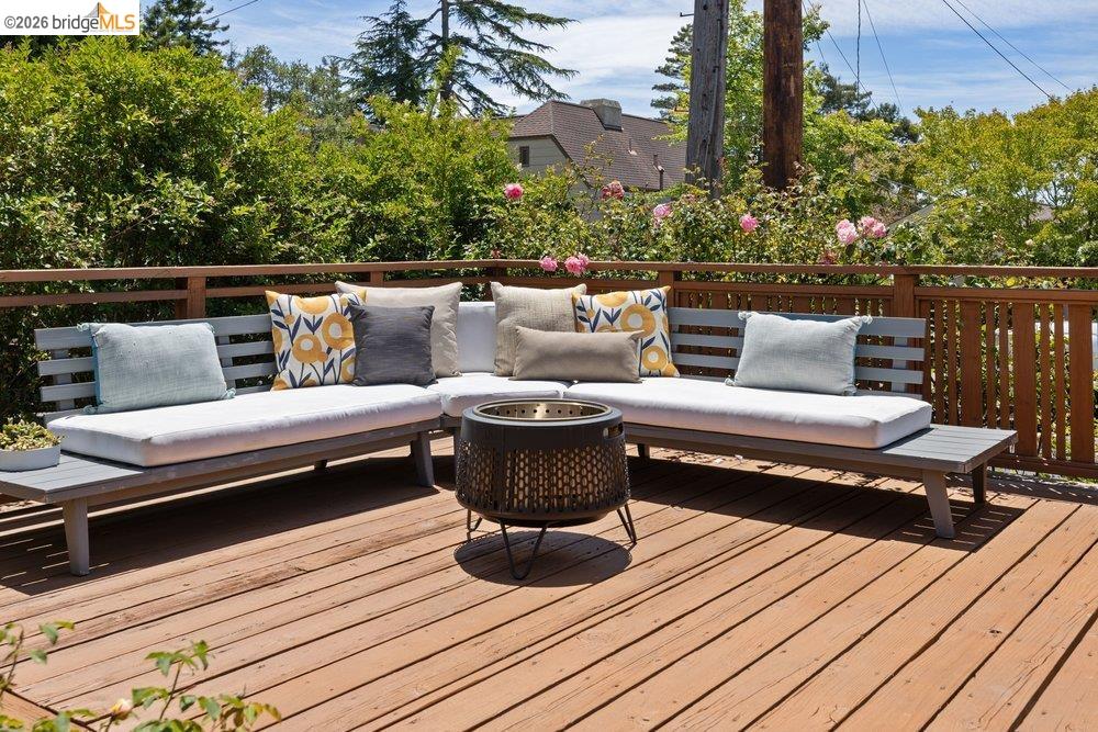 287 Purdue Avenue Kensington, CA 94708 - Photo 7 of 60 Expansive wood deck with a perimeter wood railing and surrounding mature landscaping