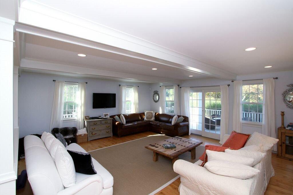 183 Stage Harbor Road Chatham, MA 02633 - Photo 9 of 35 a living room with furniture or couch and a flat screen tv