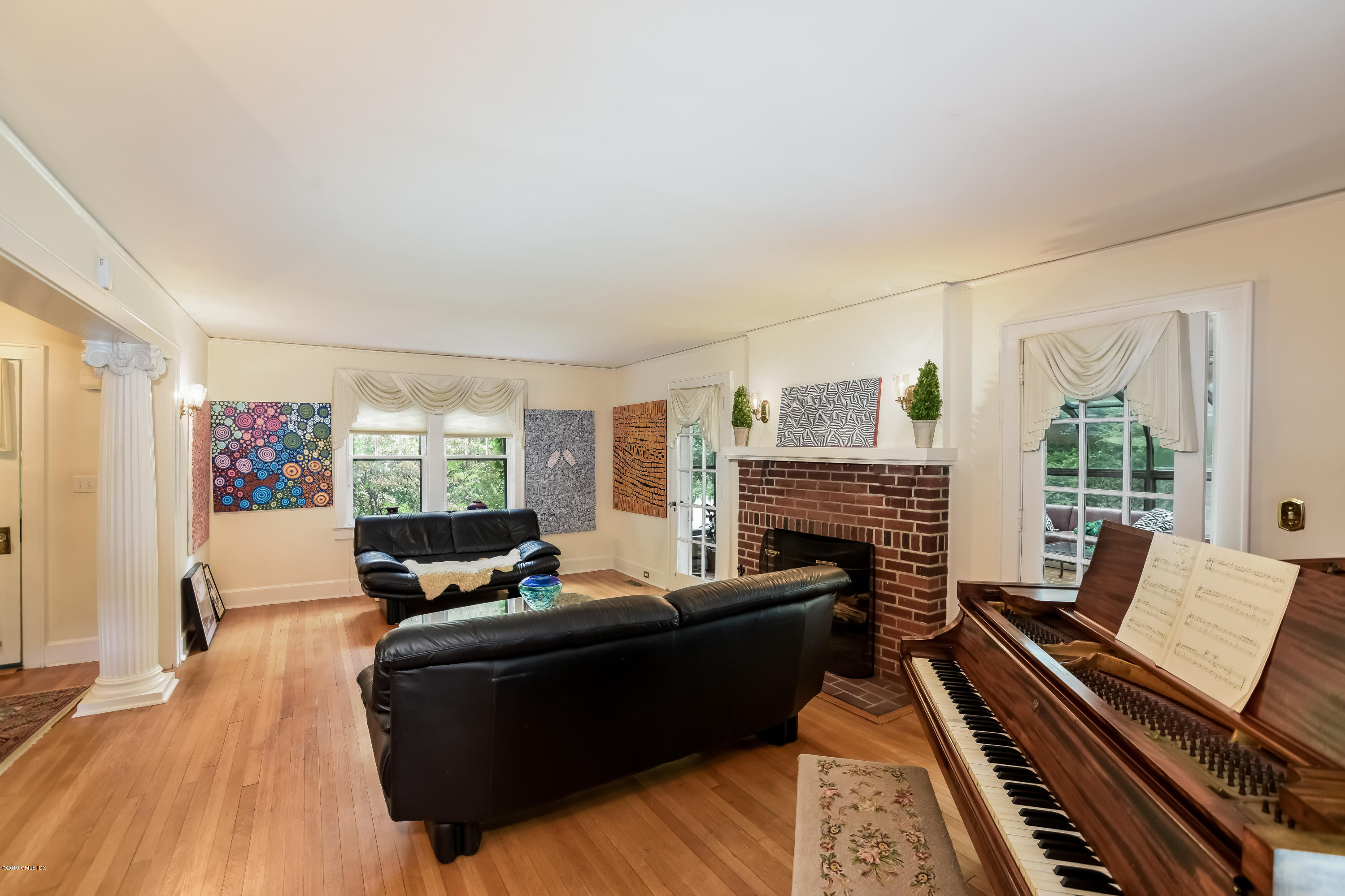 12 Old Post Road Cos Cob, CT 06830 - Photo 5 of 34 a living room with furniture fireplace and wooden floor