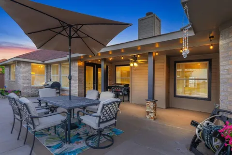 a view of a dining table and chairs in the room