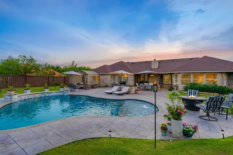a front view of house with yard and outdoor seating