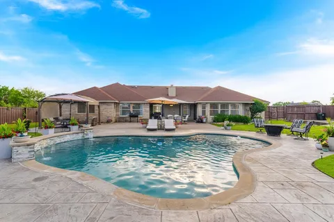 a view of a house with swimming pool