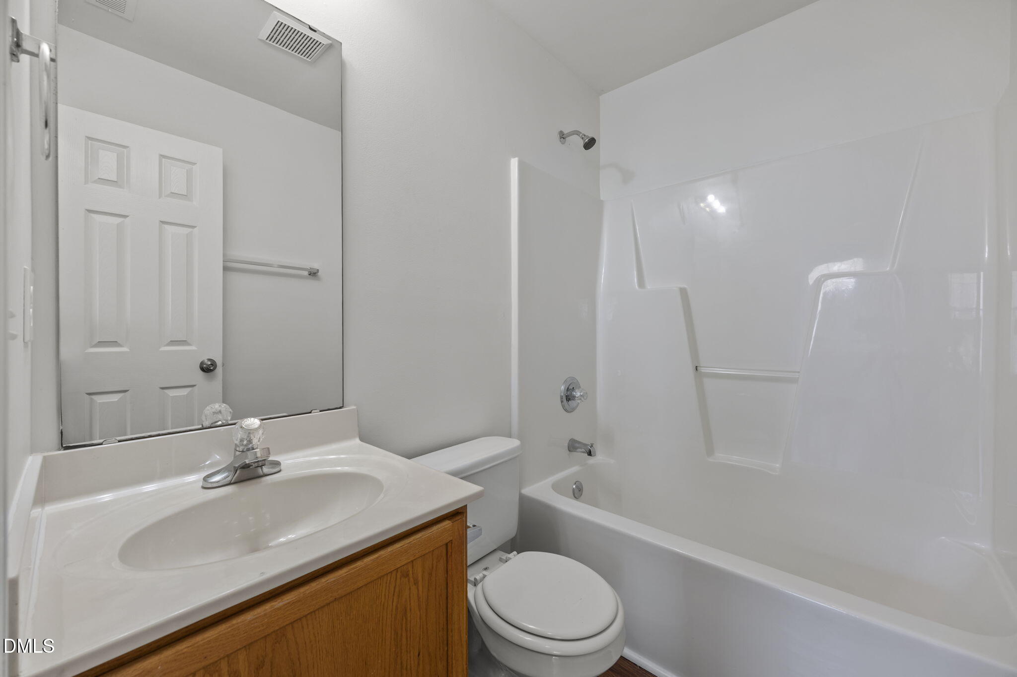 9220 Pennythorne Court Raleigh, NC 27615 - Photo 26 of 49 a bathroom with a sink a toilet and shower