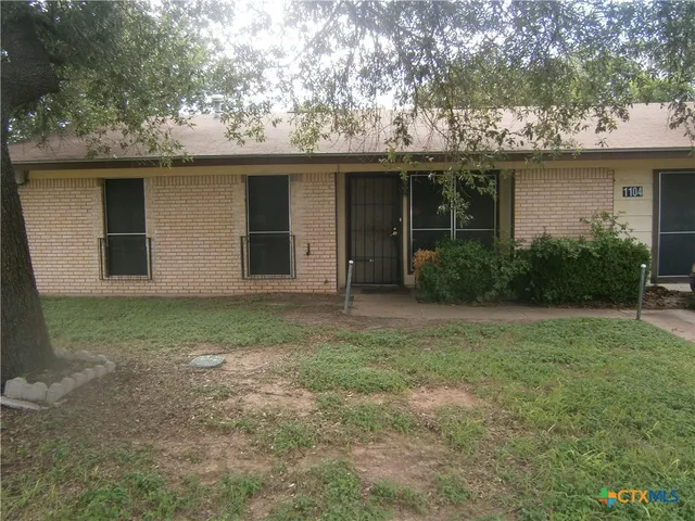 a house view with a garden space