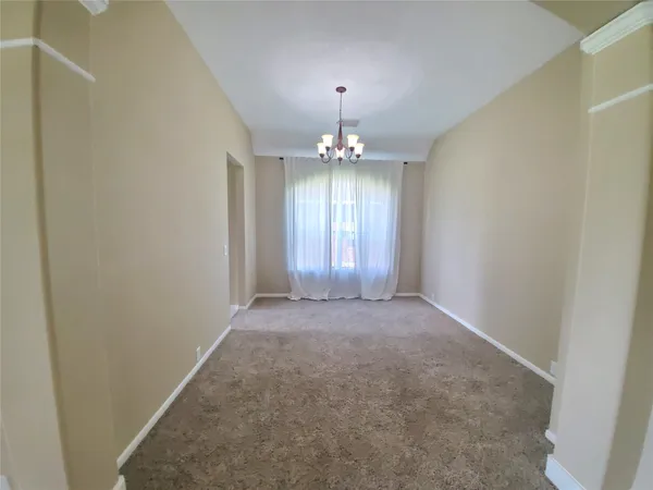 a view of a chandelier and entryway