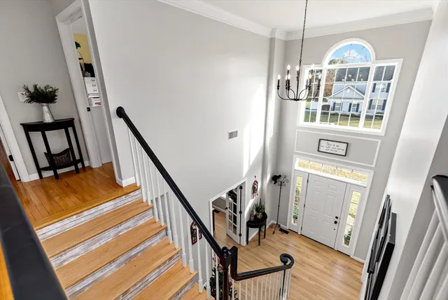 a view of an entryway with wooden floor