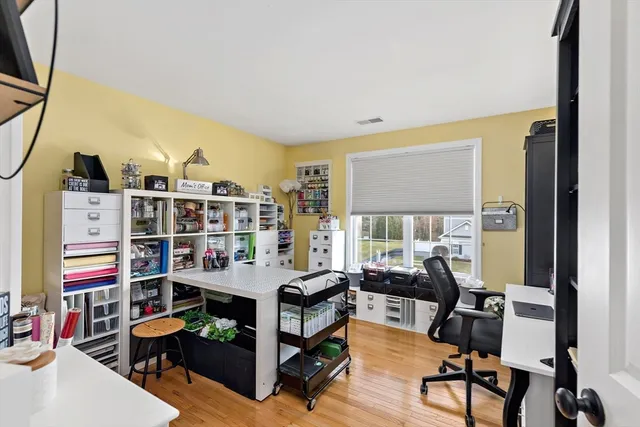 a view of a livingroom with furniture and a window