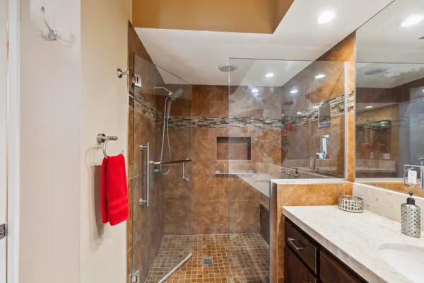 a bathroom with a sink vanity and a mirror