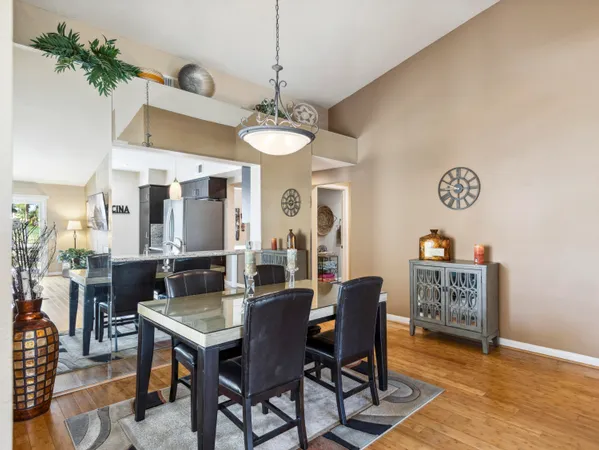 a view of a dining room with furniture and wooden floor