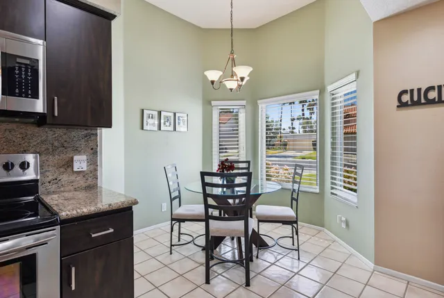 a dining room with furniture and window