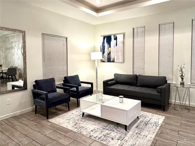 a living room with furniture and a rug