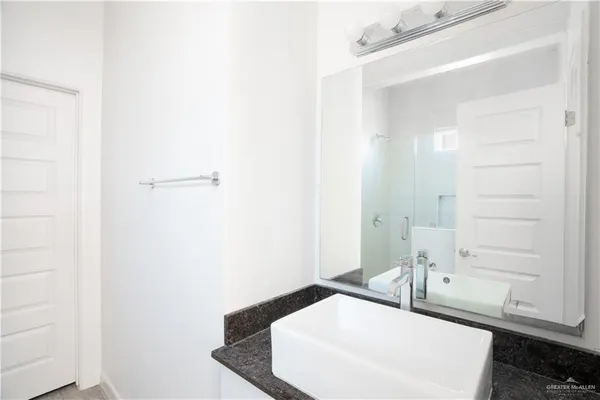a bathroom with a sink and a mirror