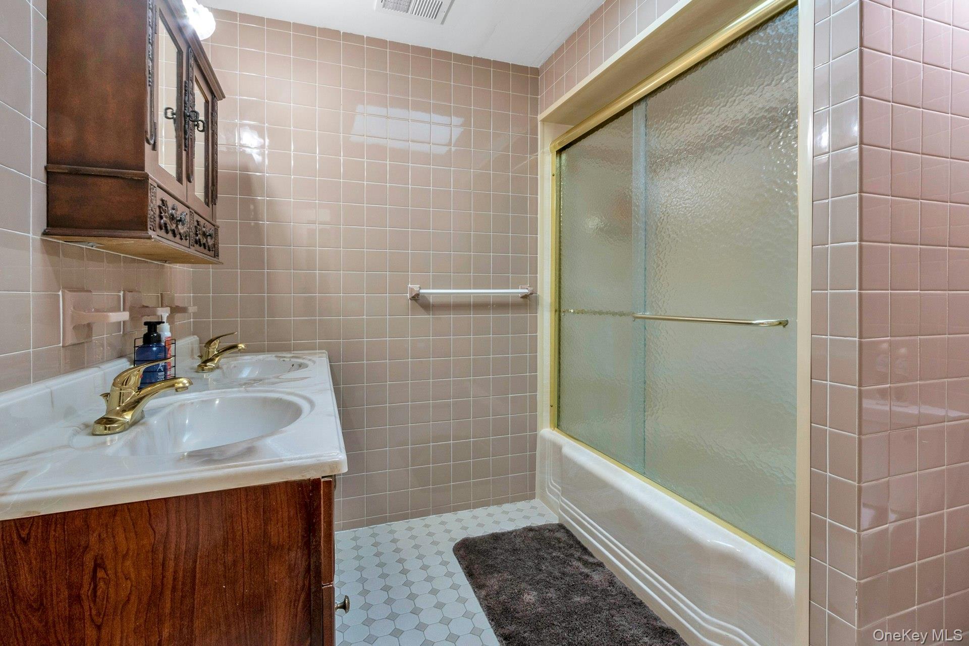 44 Greenridge Way Spring Valley, NY 10977 - Photo 18 of 46 a bathroom with a sink a toilet and shower