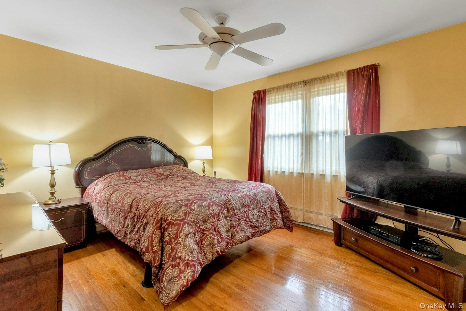 44 Greenridge Way Spring Valley, NY 10977 - Photo 20 of 46 a bedroom with a bed and a flat screen tv