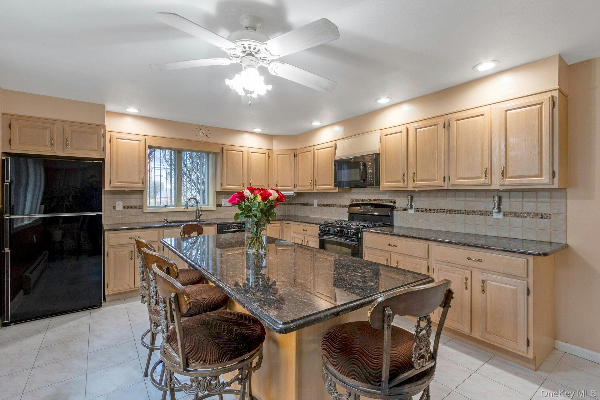 44 Greenridge Way Spring Valley, NY 10977 - Photo 26 of 46 a kitchen with stainless steel appliances granite countertop a sink dishwasher a microwave oven and a refrigerator