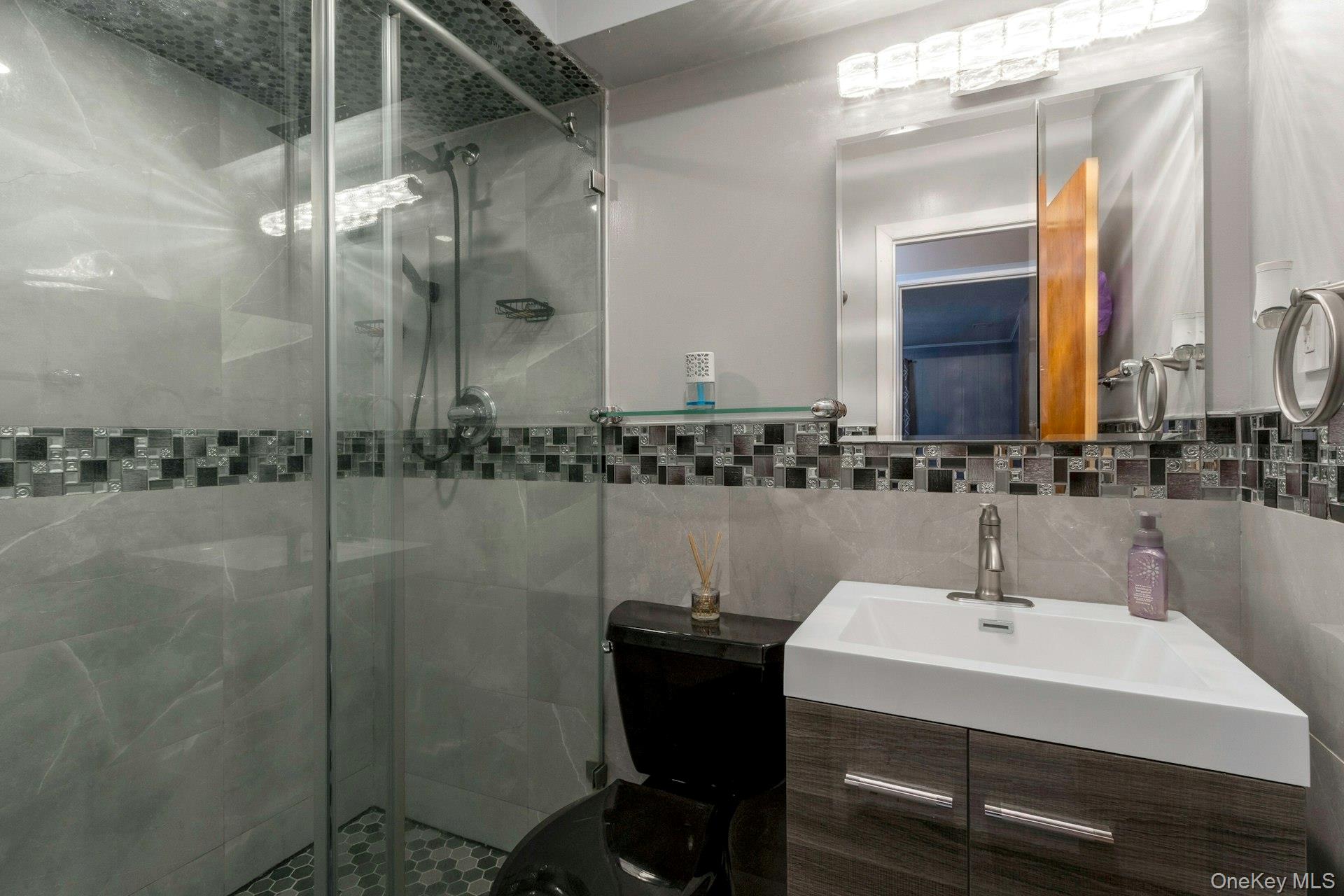 44 Greenridge Way Spring Valley, NY 10977 - Photo 33 of 46 a bathroom with a sink and mirror