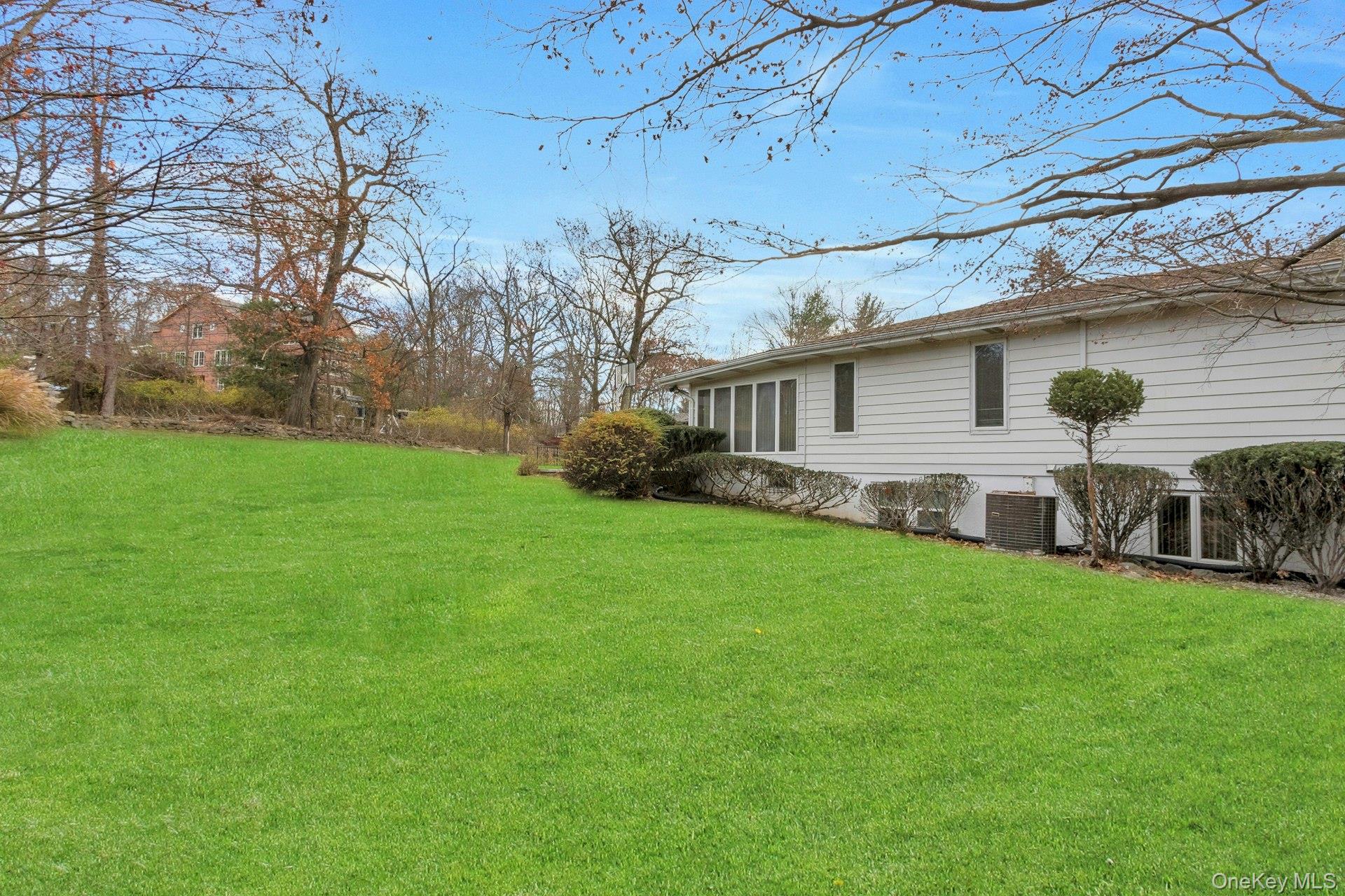 44 Greenridge Way Spring Valley, NY 10977 - Photo 37 of 46 a view of a house with backyard and porch